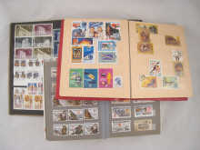 Three albums of postage stamps