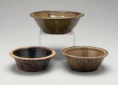 Three alkaline glaze bowls: on