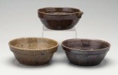 Three alkaline glaze bowls: on