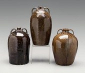 Three alkaline glaze jugs: one