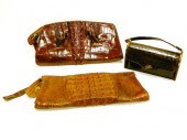Three alligator purses: one ro