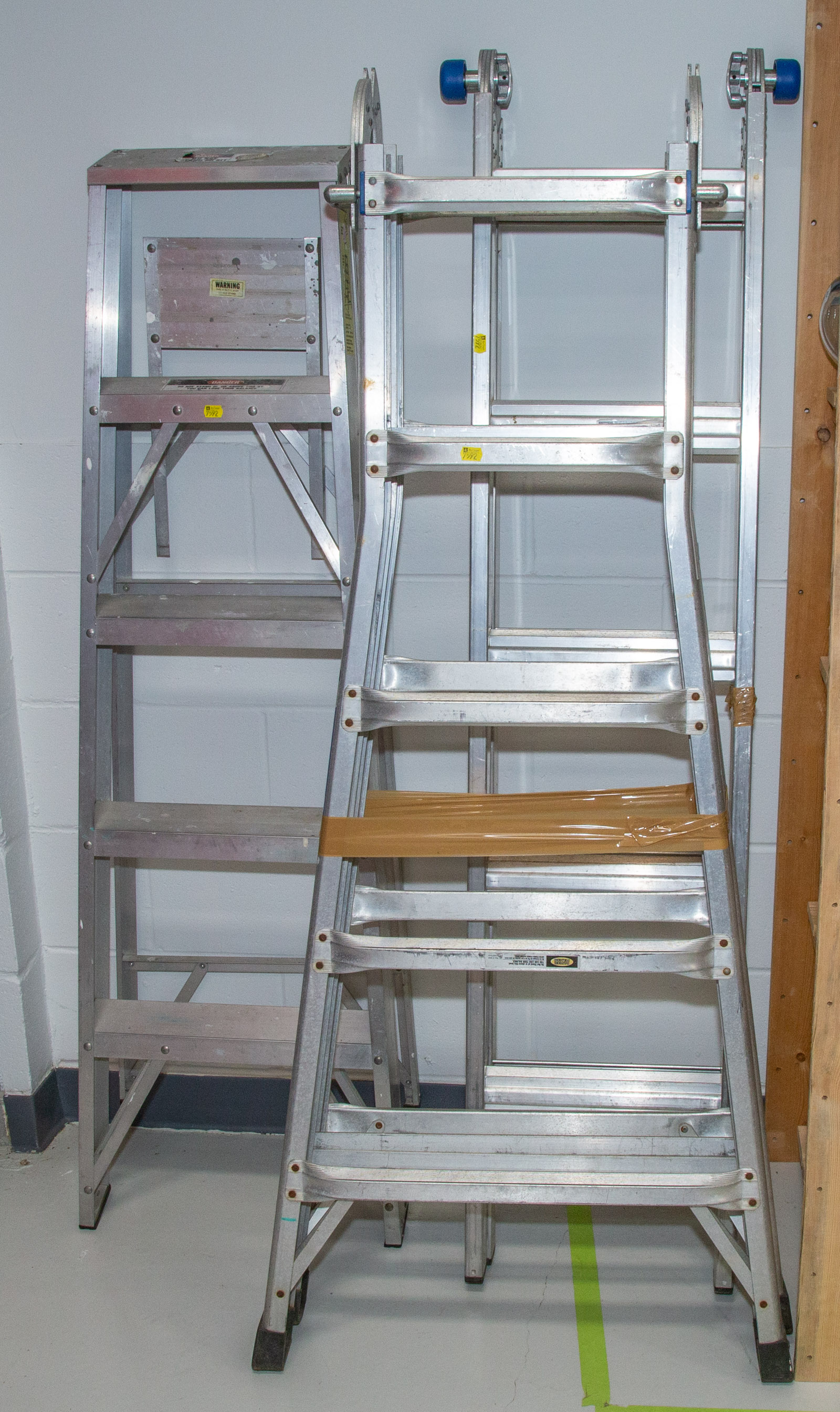 THREE ALUMINUM LADDERS .