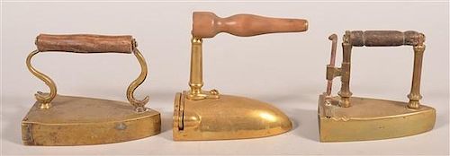 THREE ANTIQUE BRASS SLUG