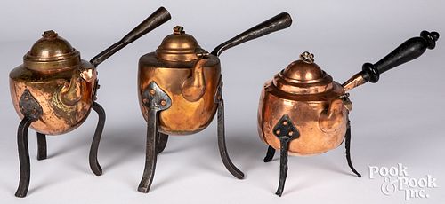THREE ANTIQUE COPPER KETTLESThree