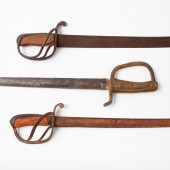 THREE ANTIQUE CUTLASSESThree a