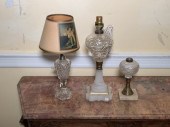Three antique lamps, including