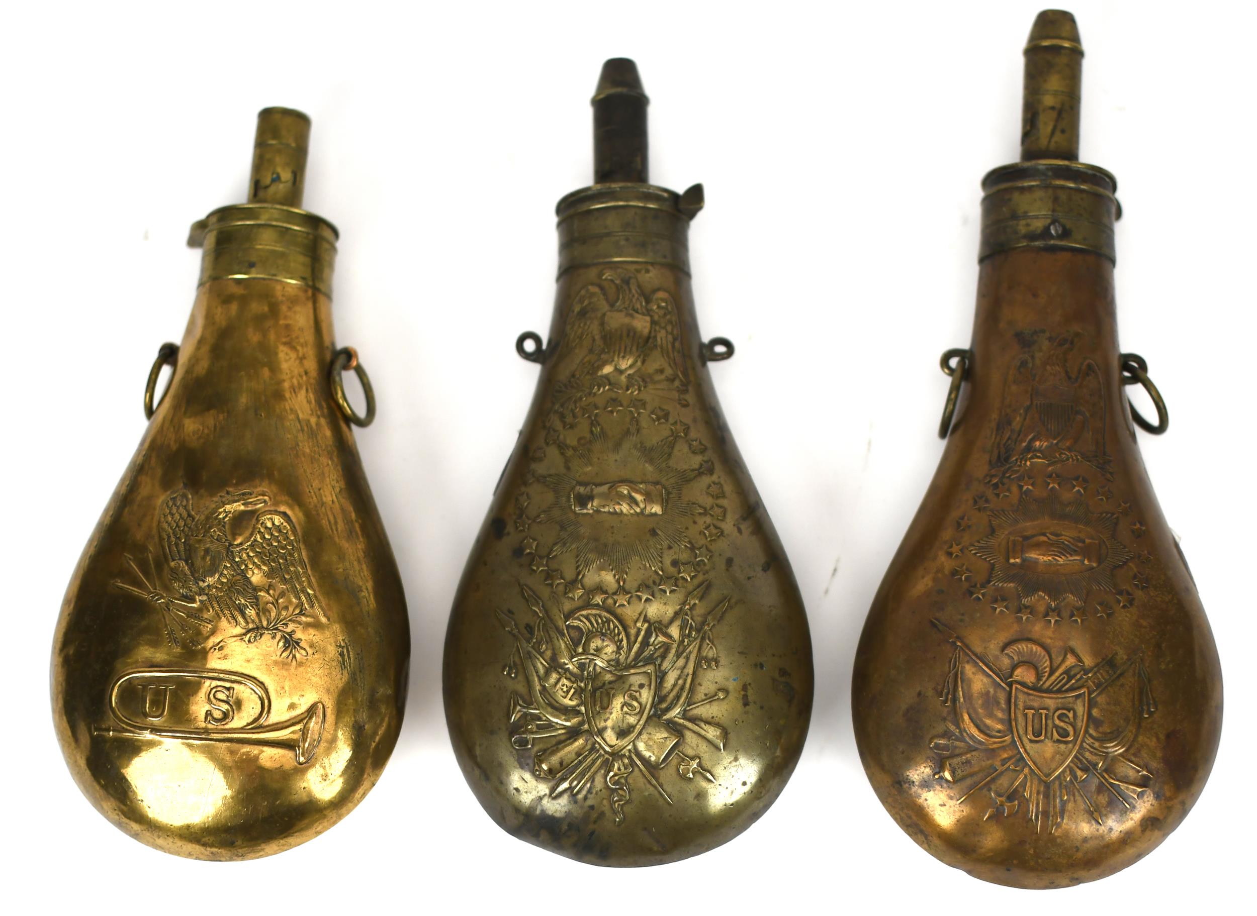THREE ANTIQUE MILITARY SHOT FLASKS.