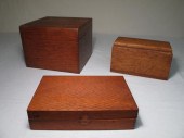Three antique wooden boxes. In