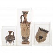 THREE ARCHAIC TERRACOTTA OBJEC
