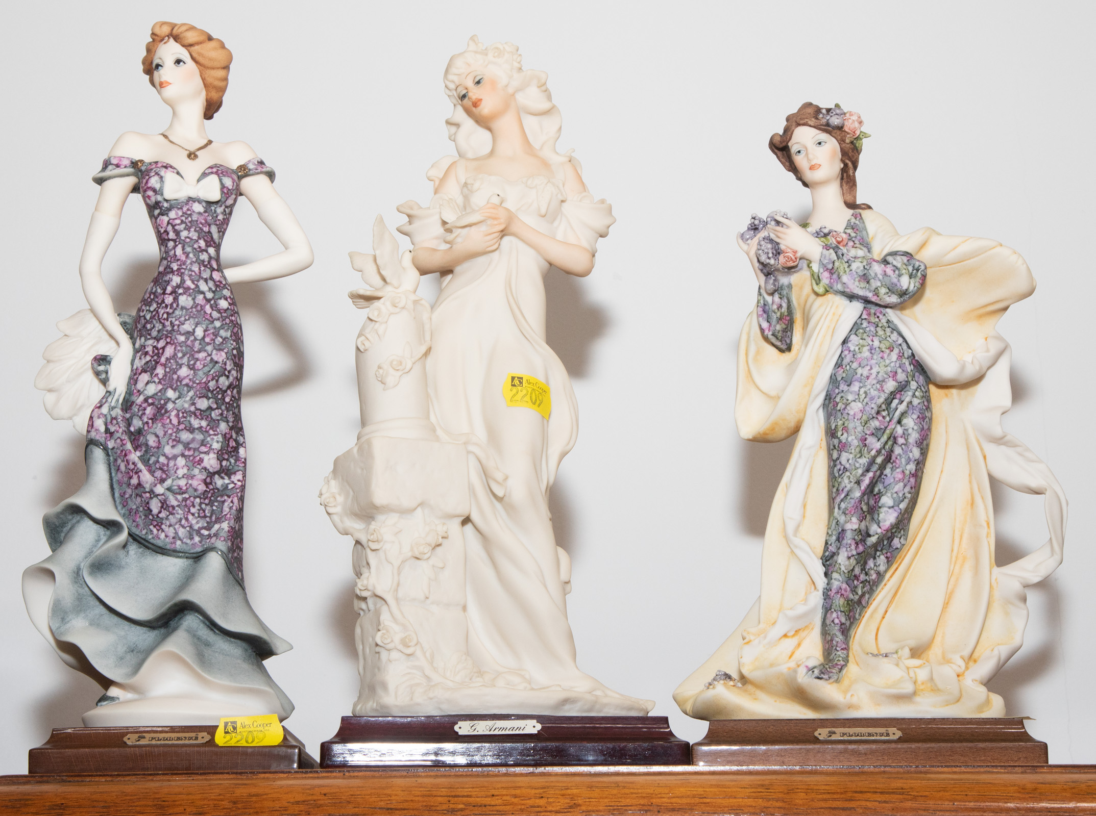 THREE ARMANI FIGURES Of elegant