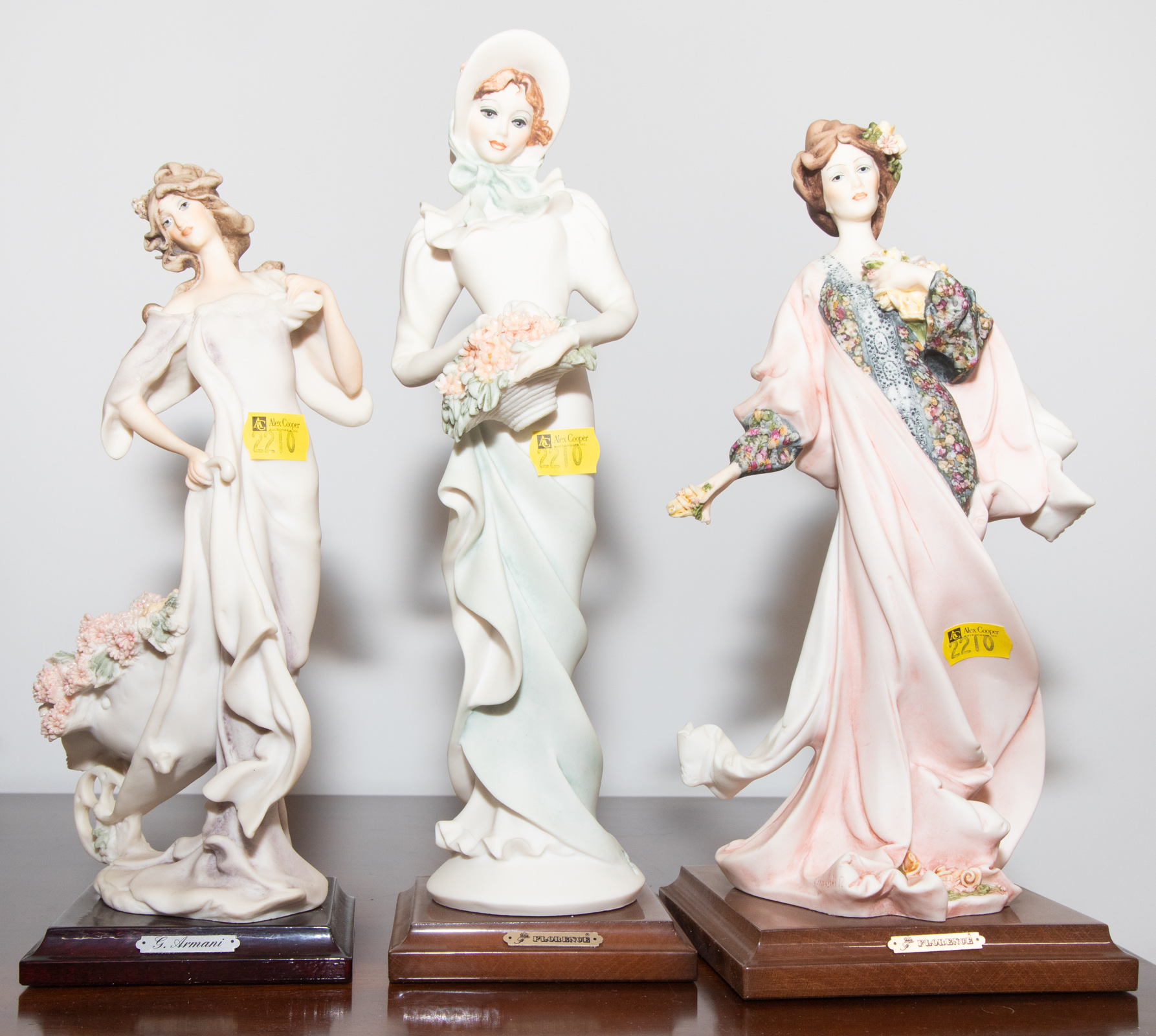 THREE ARMANI FIGURES Of elegant
