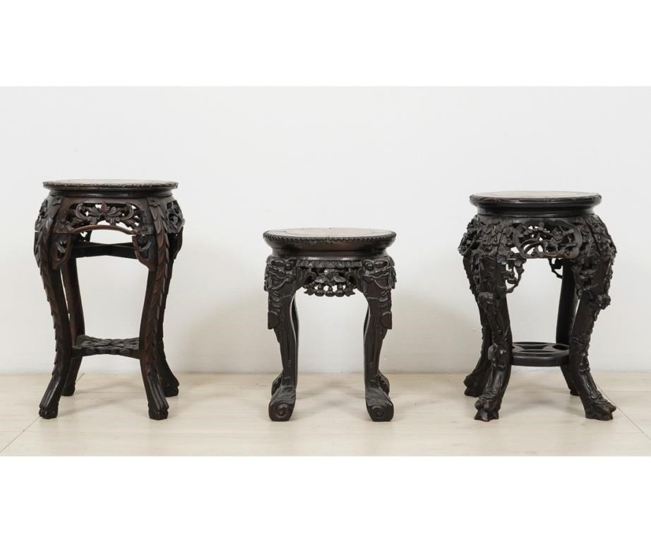 Three Asian carved plant stands,