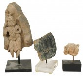 THREE ASIAN STONE RELIEF CARVI