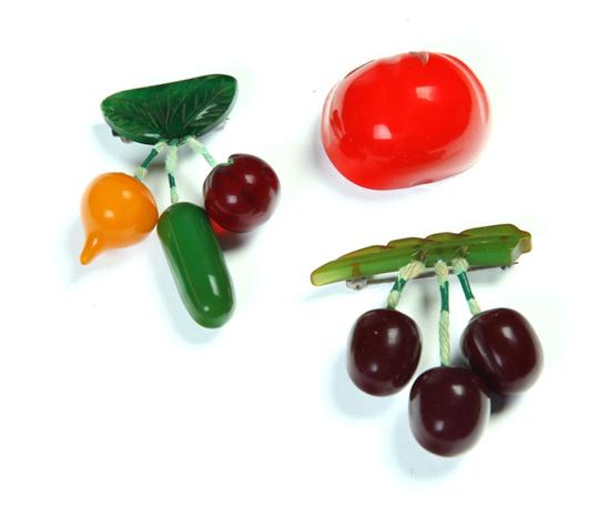 THREE BAKELITE PINS.  American. Ca.