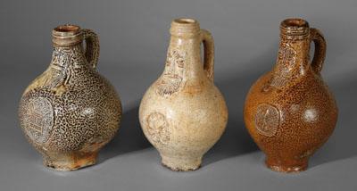 Three Bellarmine jugs, all with