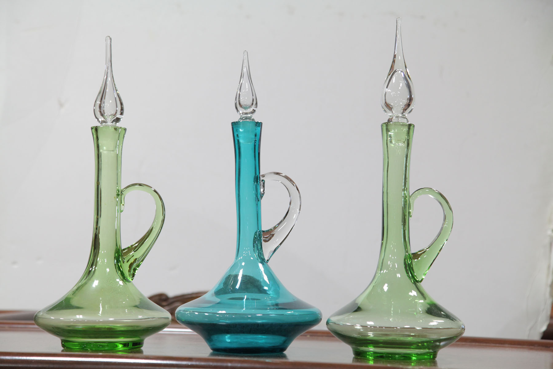 THREE BISCHOFF GLASS DECANTERS. 