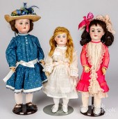THREE BISQUE HEAD DOLLSThree b