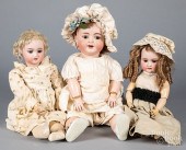 THREE BISQUE HEAD DOLLSThree b