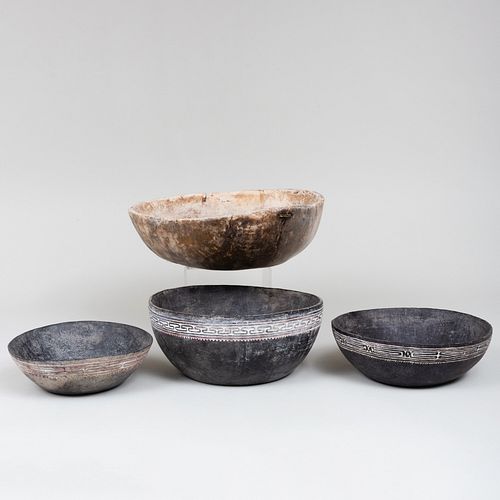 THREE BLACK PAINTED WOODEN BOWLS