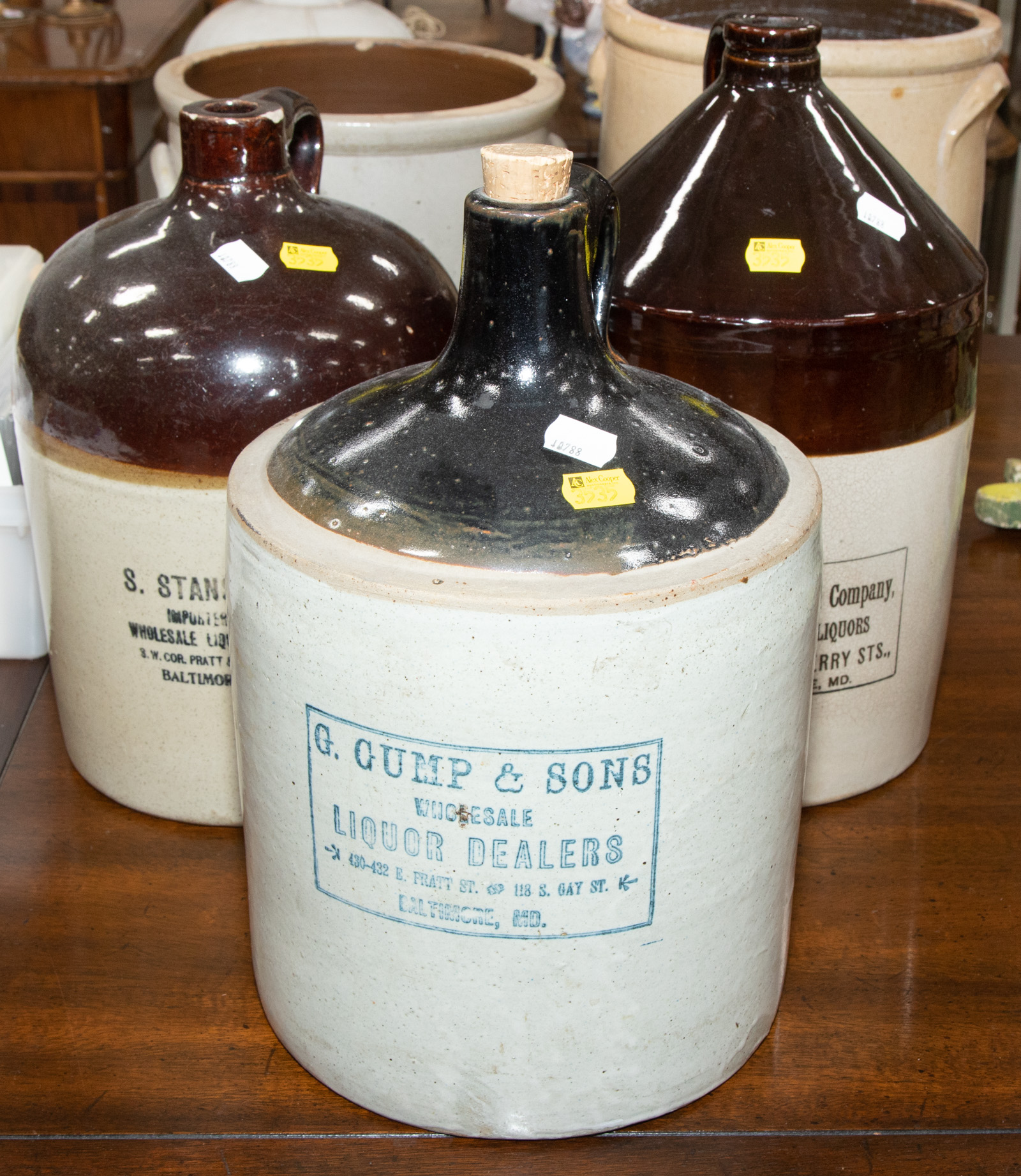 THREE BLACK TOP WHISKEY JUGS,