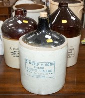 THREE BLACK TOP WHISKEY JUGS,