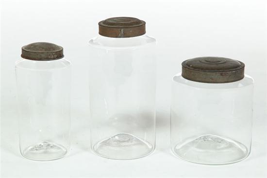 THREE BLOWN GLASS CANISTERS. 