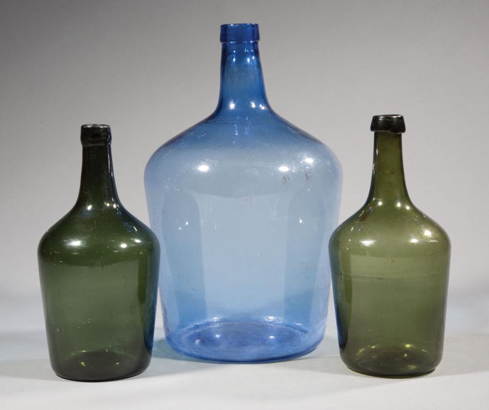 THREE BLOWN GLASS DEMIJOHNSThree