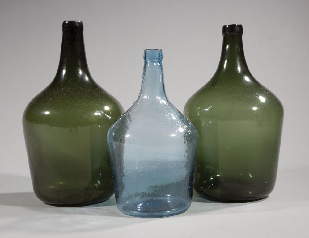 THREE BLOWN GLASS DEMIJOHNSThree