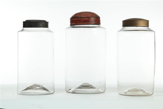 THREE BLOWN GLASS JARS WITH TIN