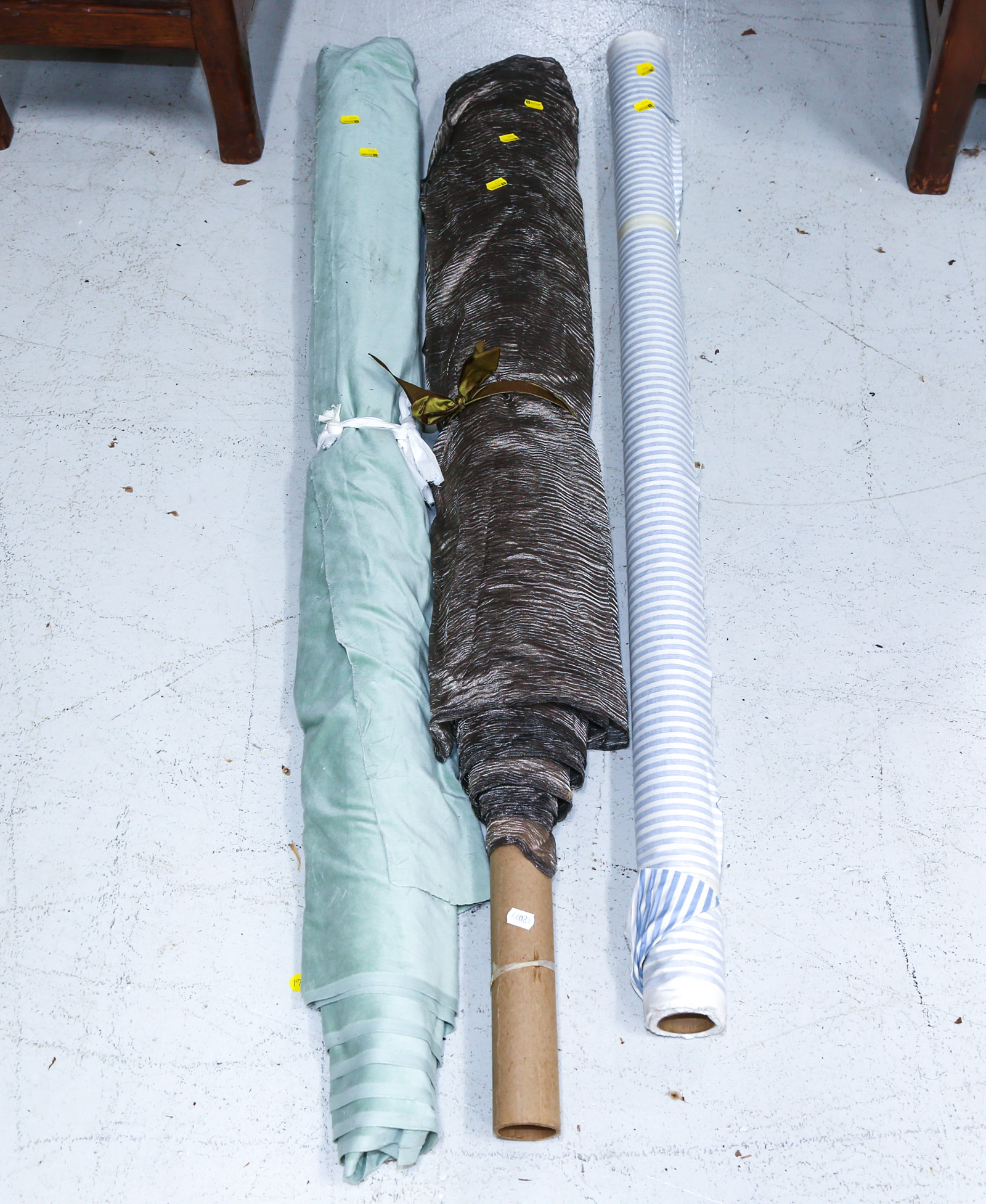 THREE BOLTS OF UPHOLSTERY FABRIC .