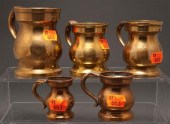 Three brass baluster-shaped me