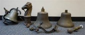 THREE BRASS BELLS AND CAST IRO