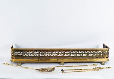 Three brass fire irons and an early