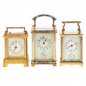 THREE BRASS & GLASS CARRIAGE C