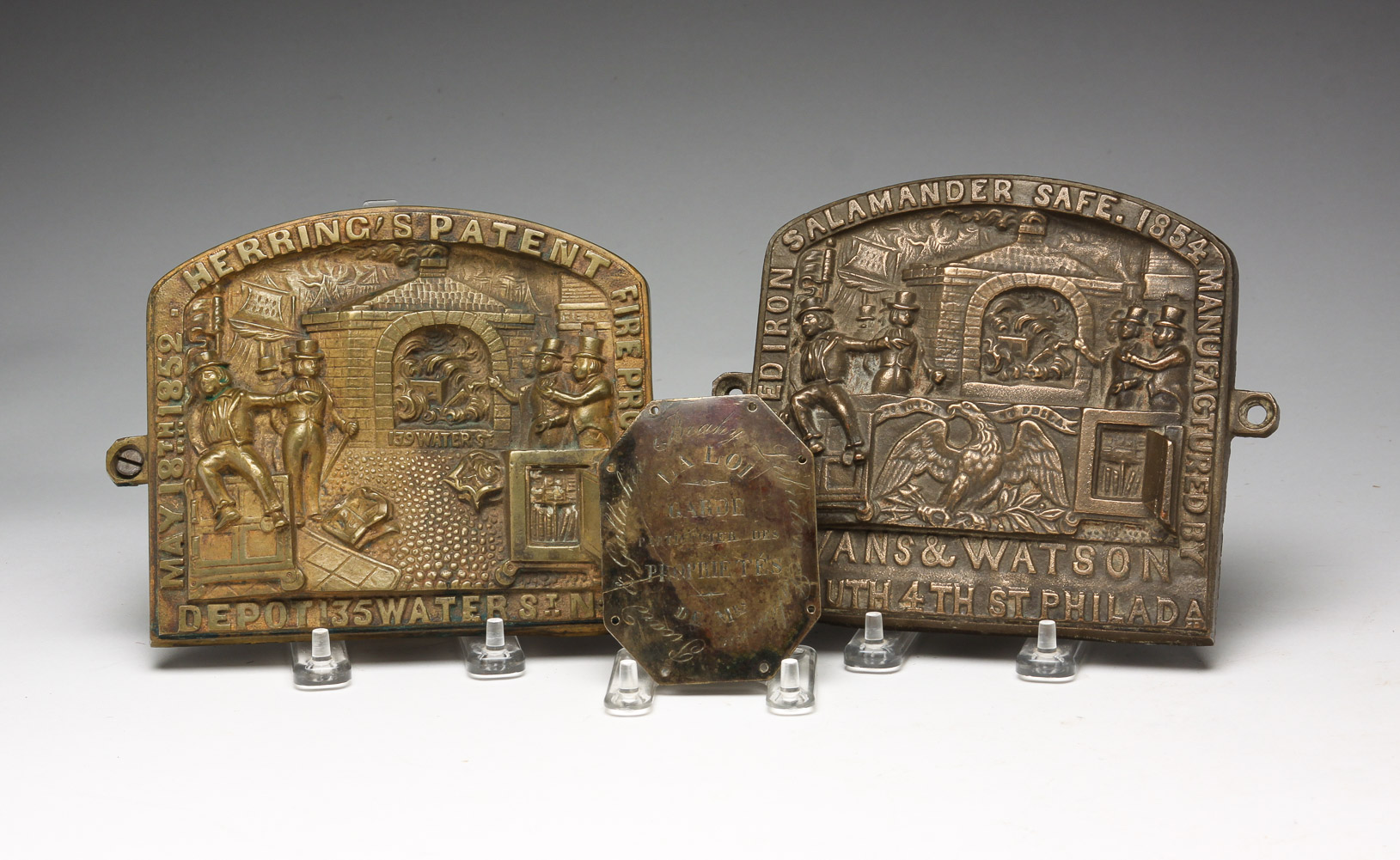 THREE BRASS PLAQUES INCLUDING