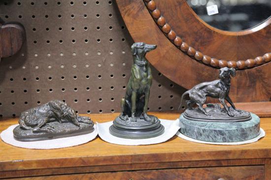 THREE BRONZE DOG SCULPTURES.