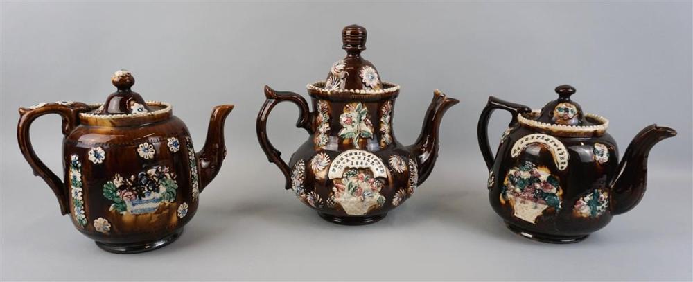 THREE BROWN TEAPOTS WITH FLORAL