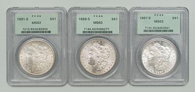 Three BU Morgan silver dollars: