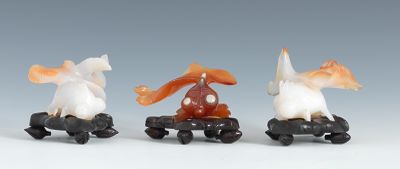 Three Carved Agate Fish on Stands