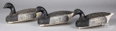 THREE CARVED AND PAINTED BRANT