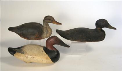 Three carved and painted