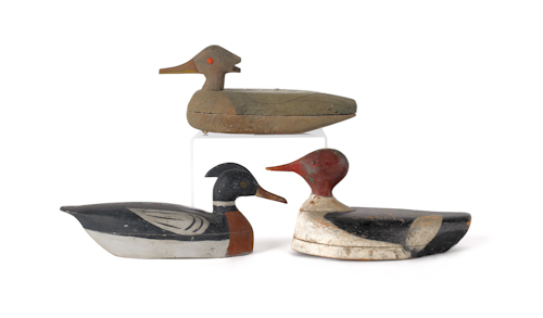 Three carved and painted