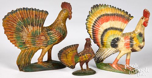 THREE CARVED AND PAINTED