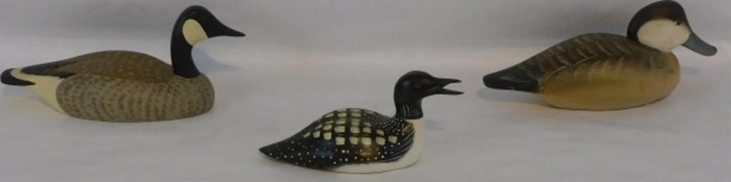 THREE CARVED AND PAINTED WOODEN
