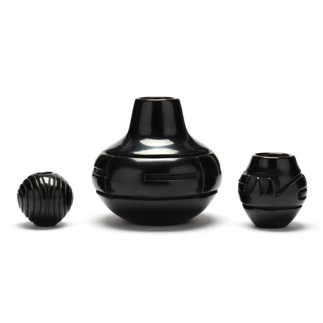 THREE CARVED BLACKWARE POTS,