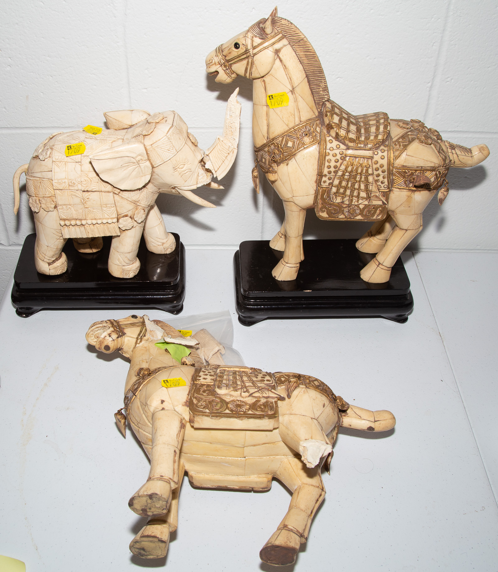 THREE CARVED BONE ANIMAL FIGURES