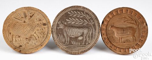 THREE CARVED COW BUTTER PRINTS,