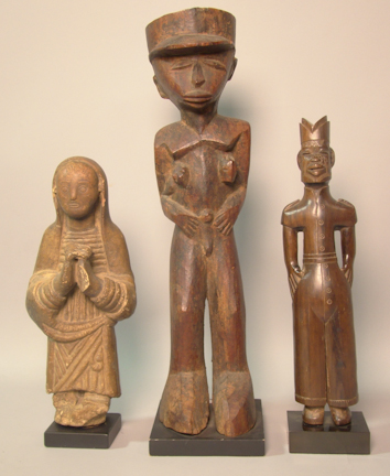 THREE CARVED FIGURES including a