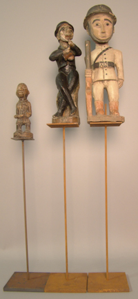 THREE CARVED FIGURES the first