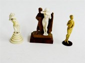 THREE CARVED IVORY FIGURES.  E